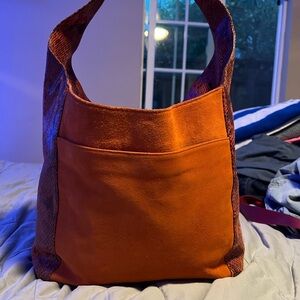 Michael kors orange satchel with snake skin .